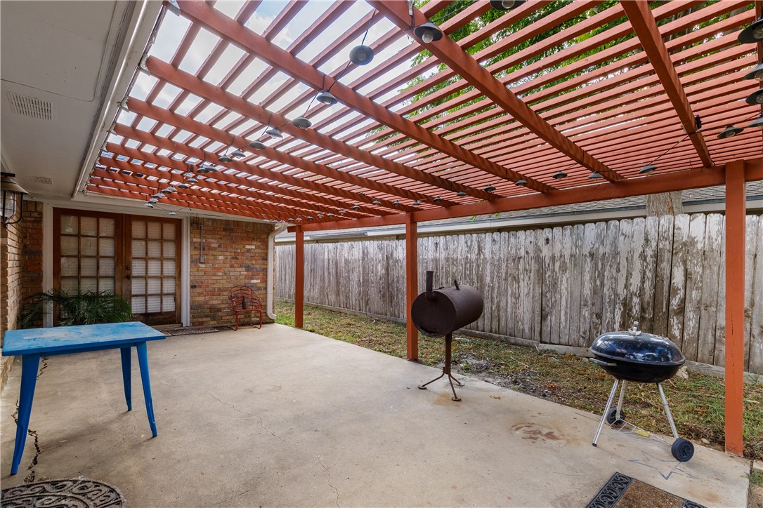 4401 Bluefield Drive Corpus Christi, TX 78413 - Photo 6 of 25 a room with furniture and a wooden door