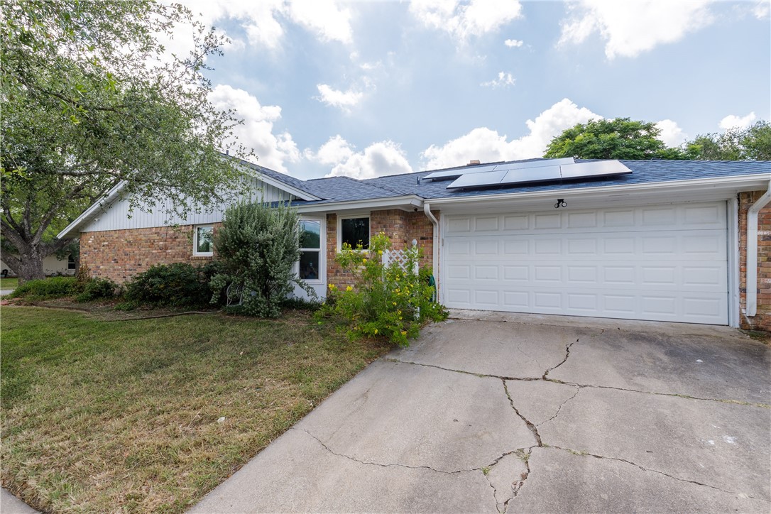 4401 Bluefield Drive Corpus Christi, TX 78413 - Photo 9 of 25 a front view of a house with garden
