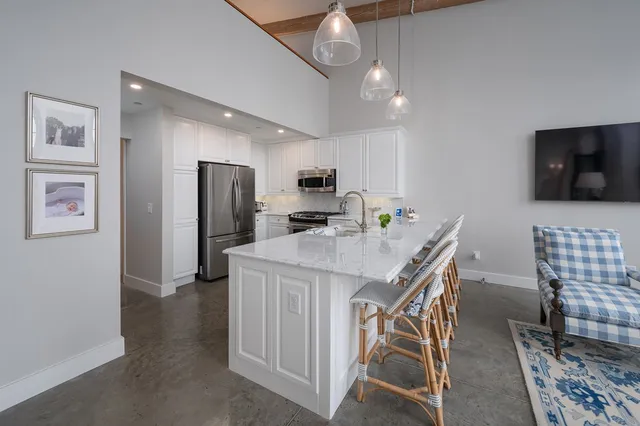 a living room with a couch and a table