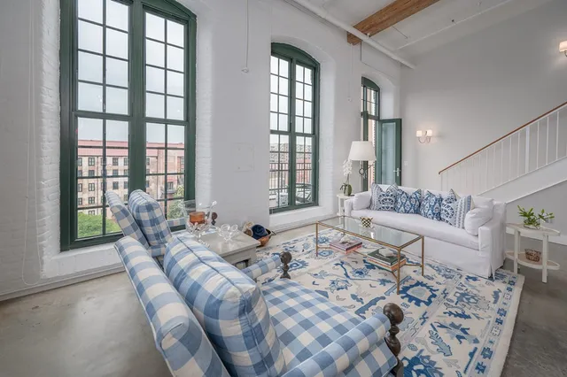 a bedroom with a bed and a mirror