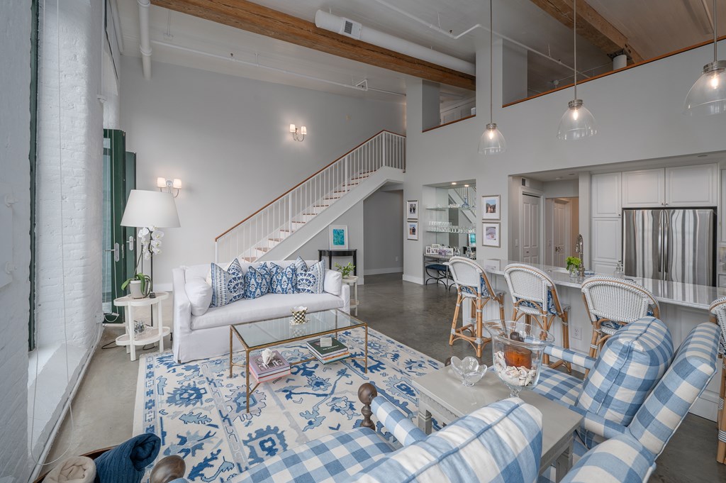 1201 Front Avenue, Unit 507 Columbus, GA 31901 - Photo 20 of 46 a living room with furniture and wooden floor