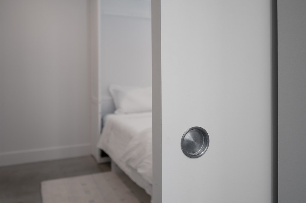 1201 Front Avenue, Unit 507 Columbus, GA 31901 - Photo 26 of 46 a bathroom with a sink and glass door