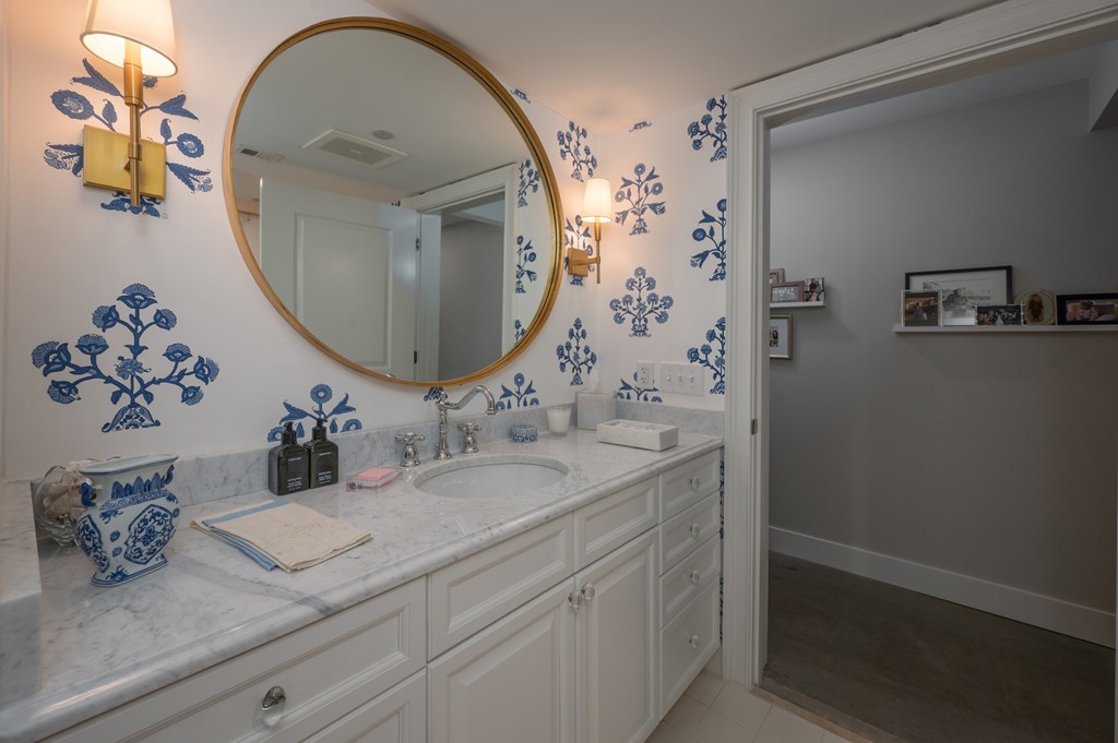 1201 Front Avenue, Unit 507 Columbus, GA 31901 - Photo 27 of 46 a bathroom with a sink mirror and vanity