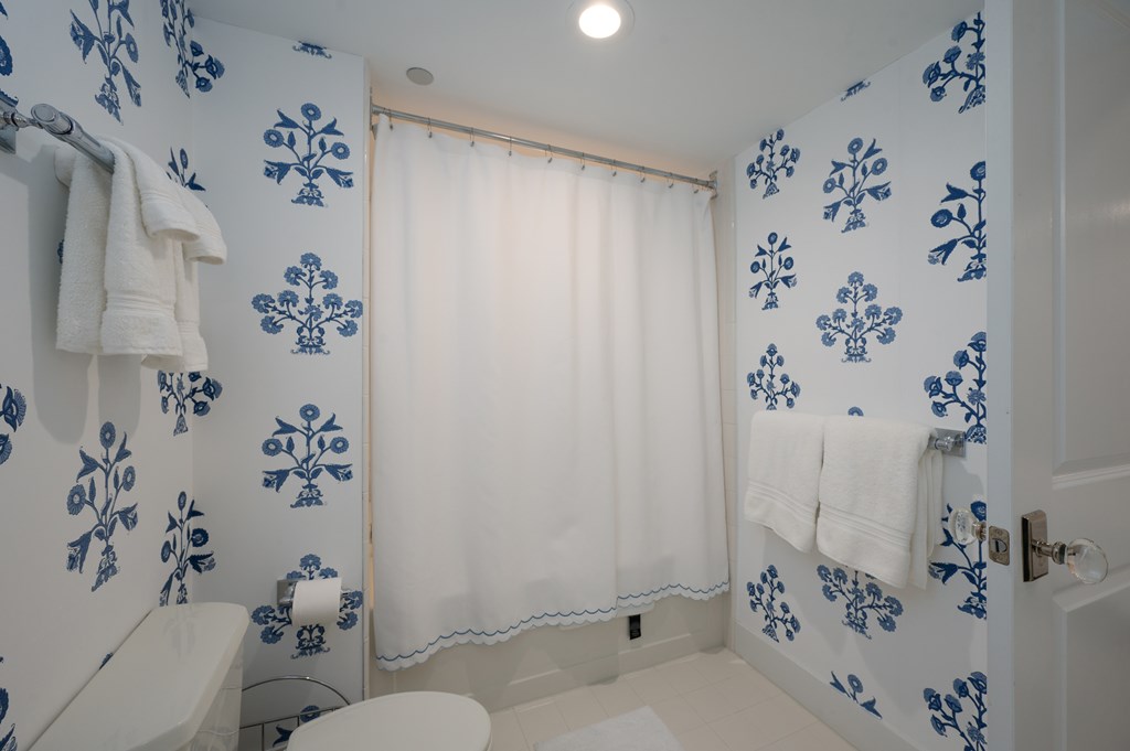 1201 Front Avenue, Unit 507 Columbus, GA 31901 - Photo 28 of 46 a bathroom with a shower curtain and a curtain