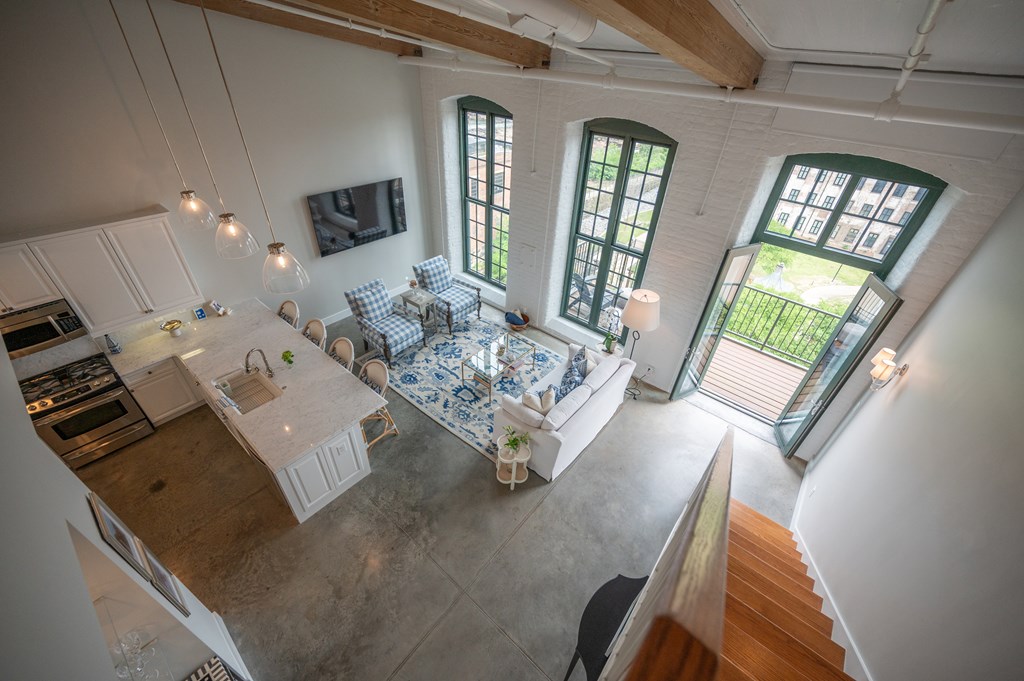 1201 Front Avenue, Unit 507 Columbus, GA 31901 - Photo 34 of 46 a living room with furniture and a table