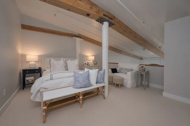 a bathroom with a shower sink vanity and mirror