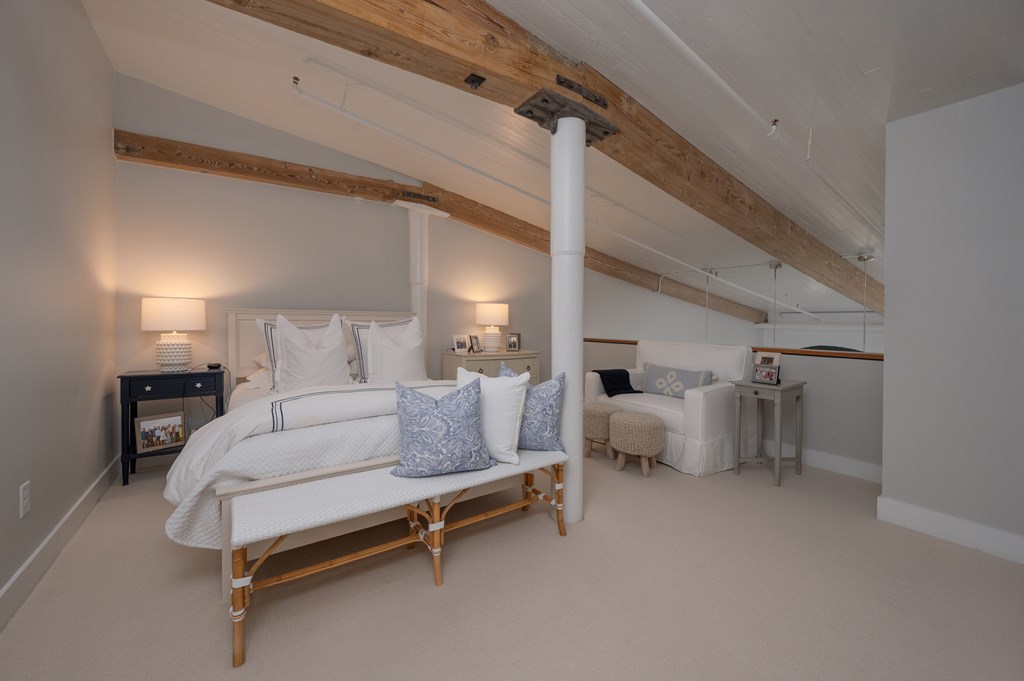 1201 Front Avenue, Unit 507 Columbus, GA 31901 - Photo 37 of 46 a living room with furniture and a fireplace