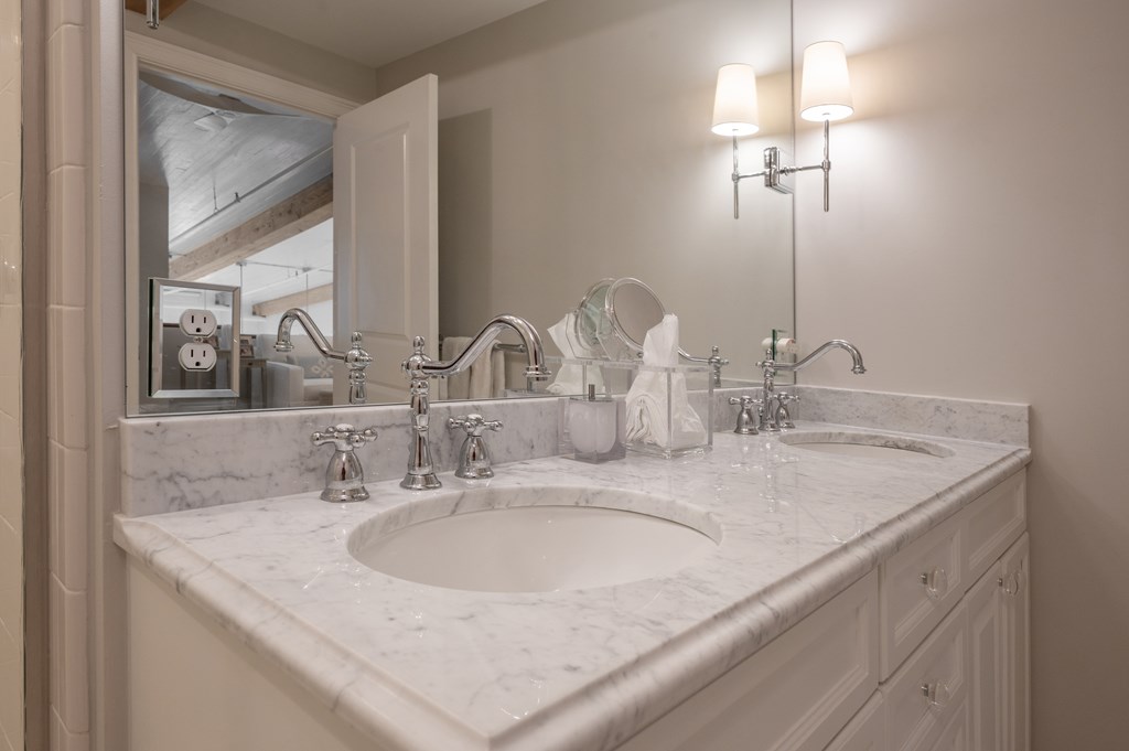1201 Front Avenue, Unit 507 Columbus, GA 31901 - Photo 43 of 46 a bathroom with double sink and a mirror