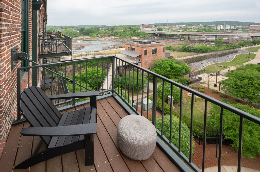 1201 Front Avenue, Unit 507 Columbus, GA 31901 - Photo 9 of 46 a view of a chairs and table in the balcony