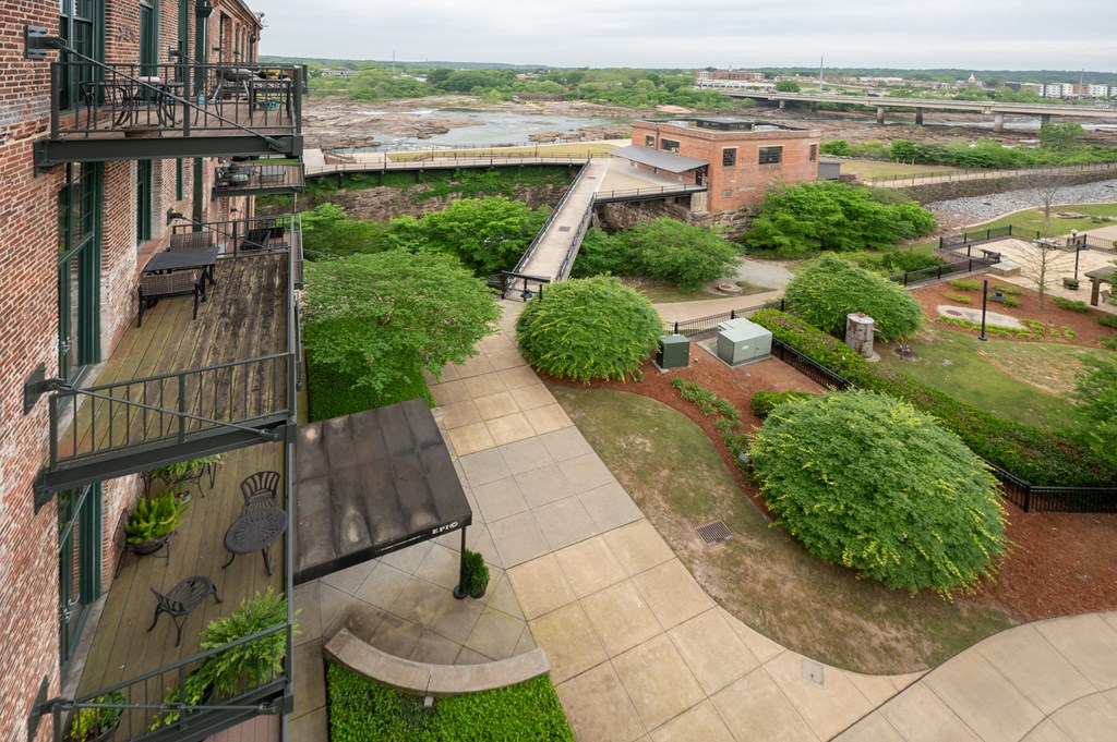 1201 Front Avenue, Unit 507 Columbus, GA 31901 - Photo 10 of 46 a view of a lake with a building in the background