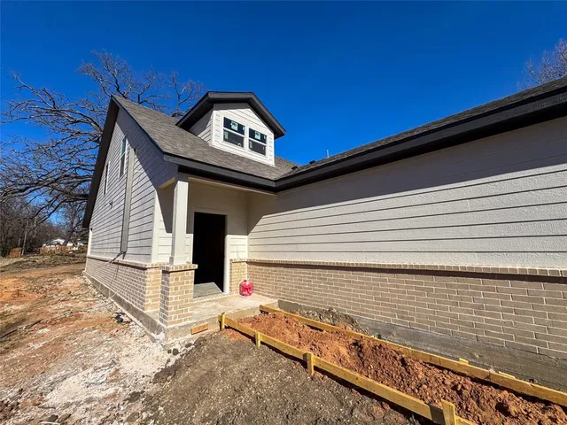 a view of a wooden door of the house