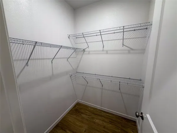 a view of a room with racks on the wall