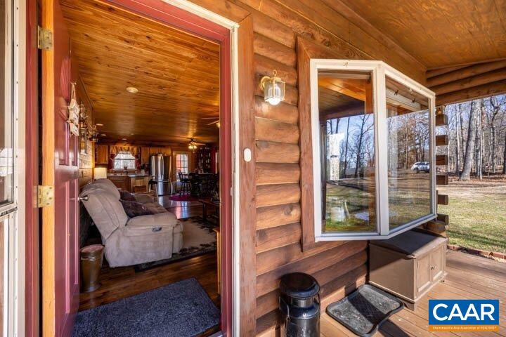5880 Mechunk Ridge Lane Keswick, VA 22947 - Photo 11 of 38 a view of living room and patio