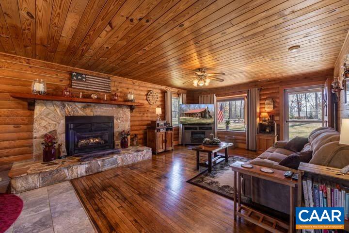 5880 Mechunk Ridge Lane Keswick, VA 22947 - Photo 14 of 38 a living room with furniture and a fireplace