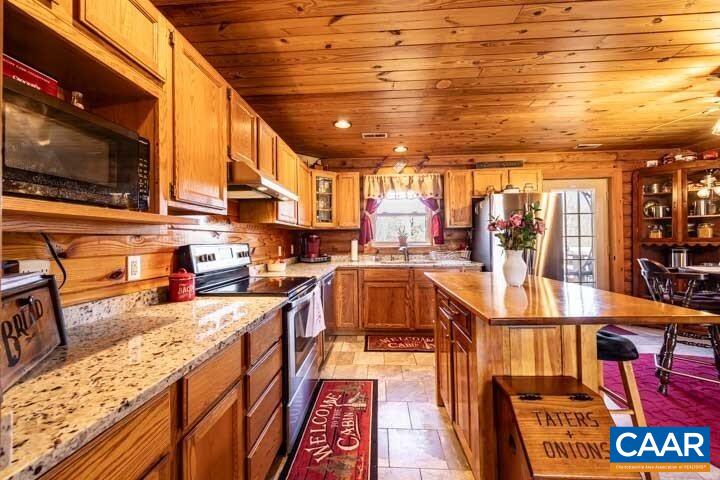 5880 Mechunk Ridge Lane Keswick, VA 22947 - Photo 20 of 38 a view of a kitchen with furniture and a kitchen