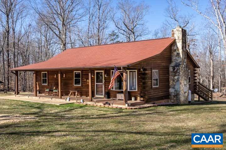 5880 Mechunk Ridge Lane Keswick, VA 22947 - Photo 2 of 38 a front view of a house with swimming pool