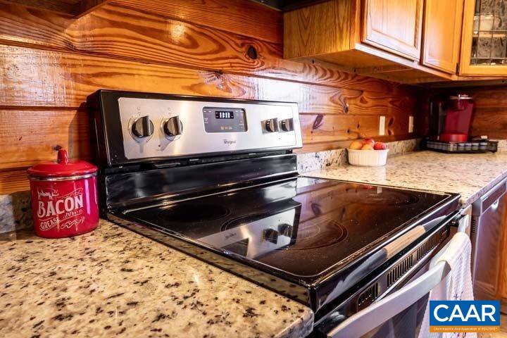 5880 Mechunk Ridge Lane Keswick, VA 22947 - Photo 22 of 38 a stove top oven sitting inside of a kitchen