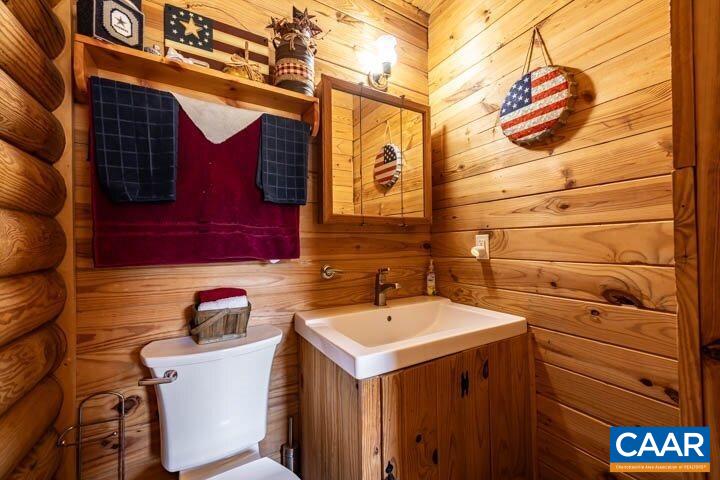 5880 Mechunk Ridge Lane Keswick, VA 22947 - Photo 28 of 38 a bathroom with a sink and a vanity