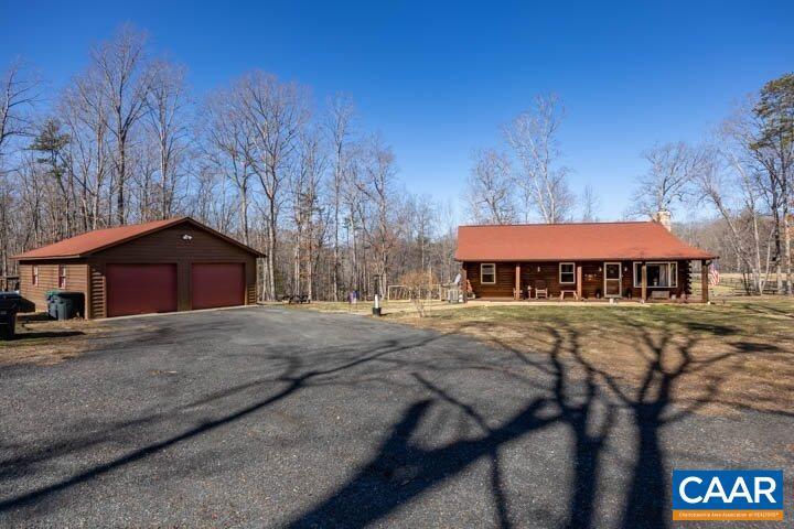 5880 Mechunk Ridge Lane Keswick, VA 22947 - Photo 3 of 38 a view of a house with yard and sitting area