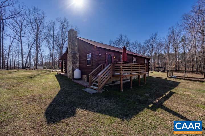 5880 Mechunk Ridge Lane Keswick, VA 22947 - Photo 35 of 38 a view of a house with a yard porch and sitting area