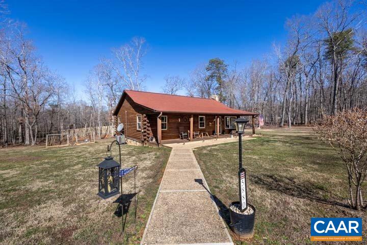 5880 Mechunk Ridge Lane Keswick, VA 22947 - Photo 5 of 38 a view of a house with a yard