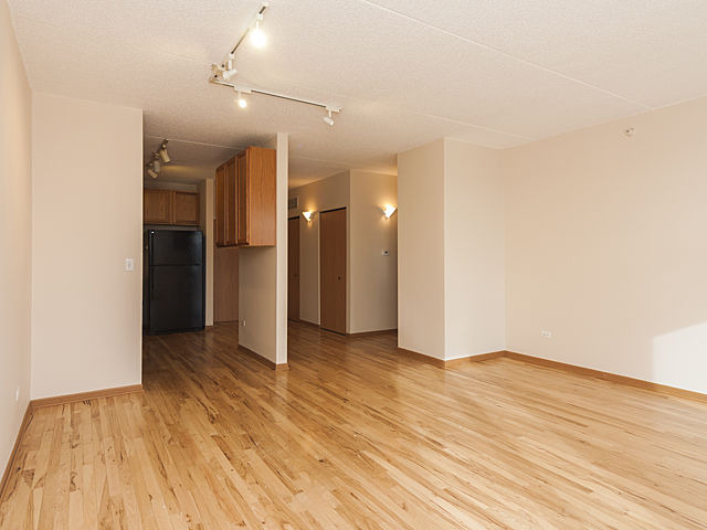 515 Main Street, Unit 707 Evanston, IL 60202 - Photo 2 of 12 a view of an empty room with wooden floor