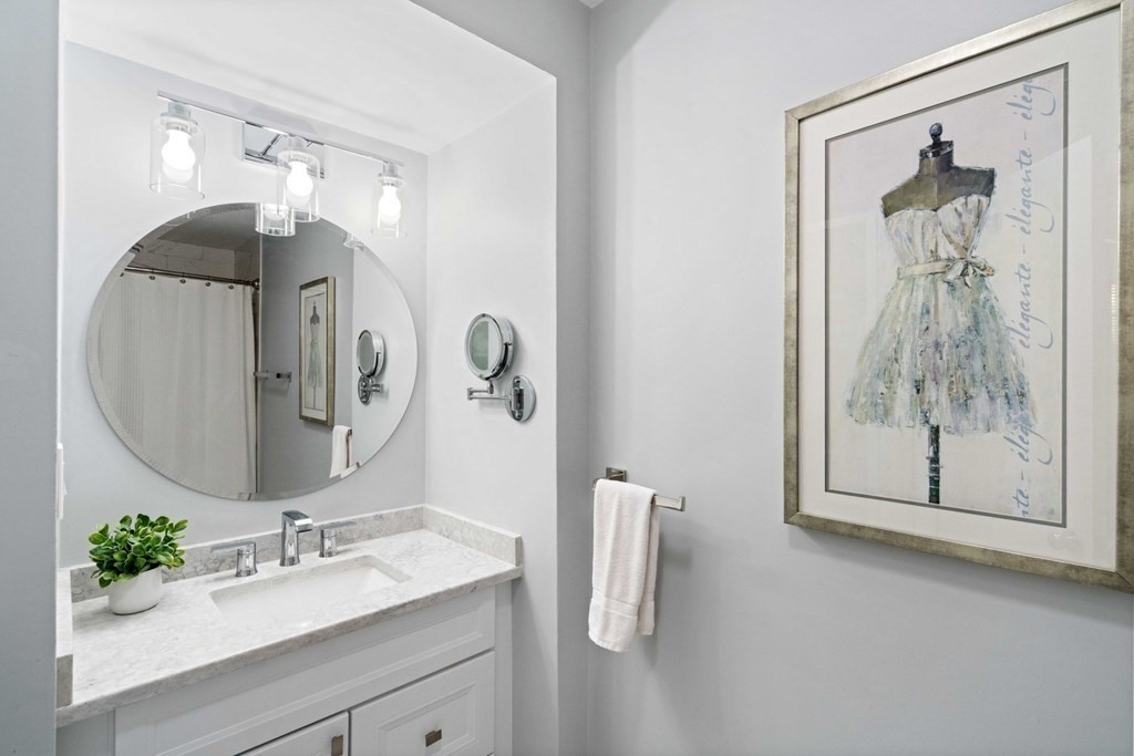 226 Commonwealth Avenue, Unit 1 Boston, MA 02116 - Photo 12 of 17 a bathroom with a sink vanity and mirror