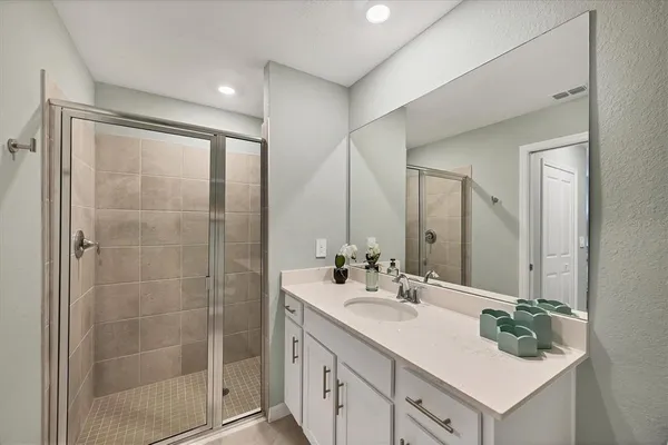 a living room with furniture and floor to ceiling windows