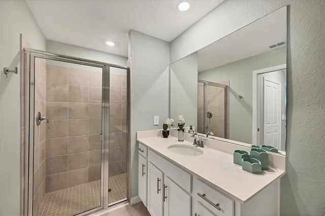 a living room with furniture and floor to ceiling windows