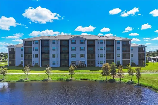 an aerial view of a pool patio swimming pool and outdoor seating