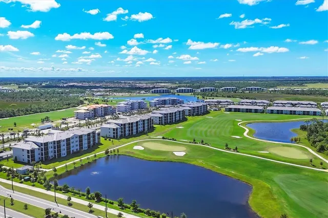 a view of a swimming pool with lawn chairs
