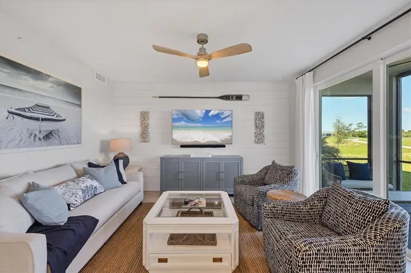 a kitchen with stainless steel appliances granite countertop a stove a sink a microwave a refrigerator and cabinets