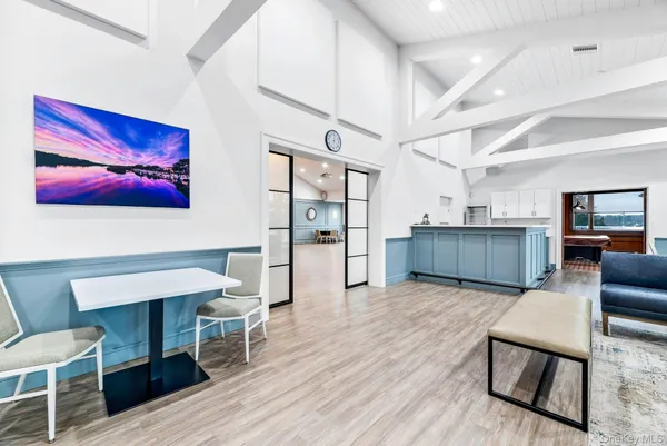a view of a livingroom with furniture and wooden floor