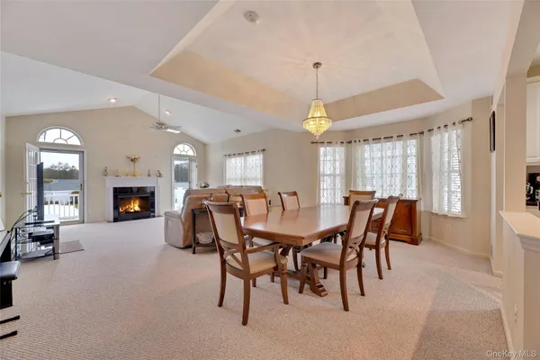 a dining room with furniture and window