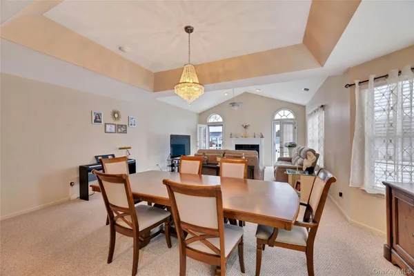 a view of a dining room with furniture and window