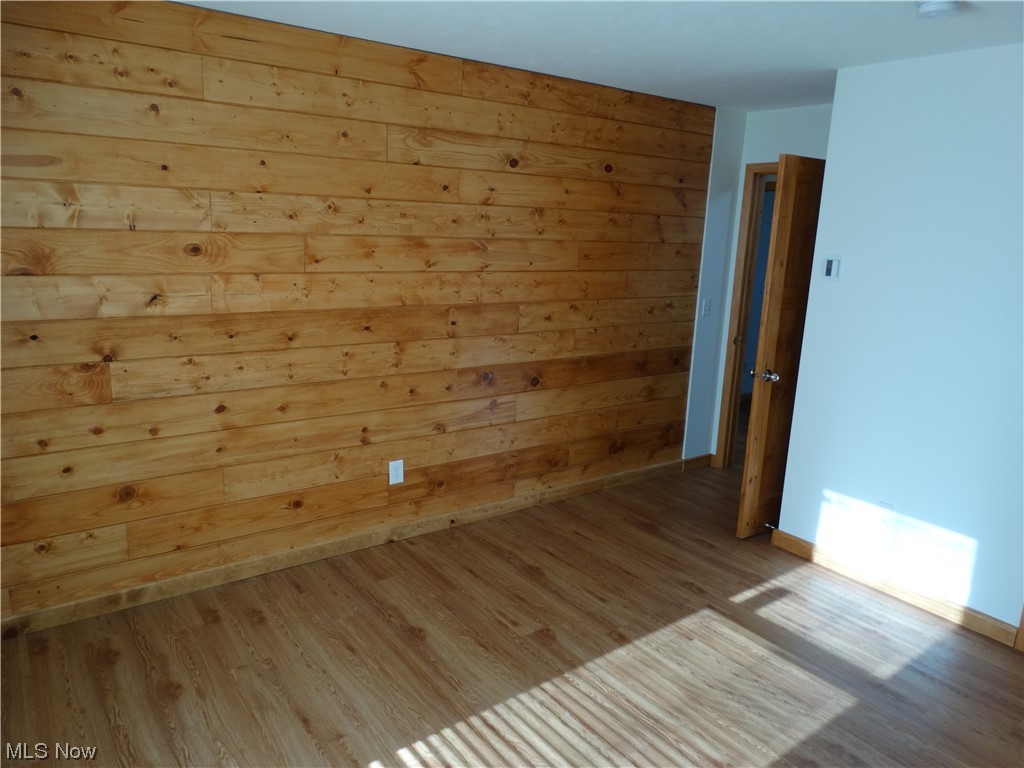 4100 Dayton Road Madison, OH 44057 - Photo 25 of 25 Pine one one wall in 2 bedrooms, seller at one used this 2 rooms as one large office/bedroom. There is insulation and pine wood and these could be opened back up to a large bedroom if needed.