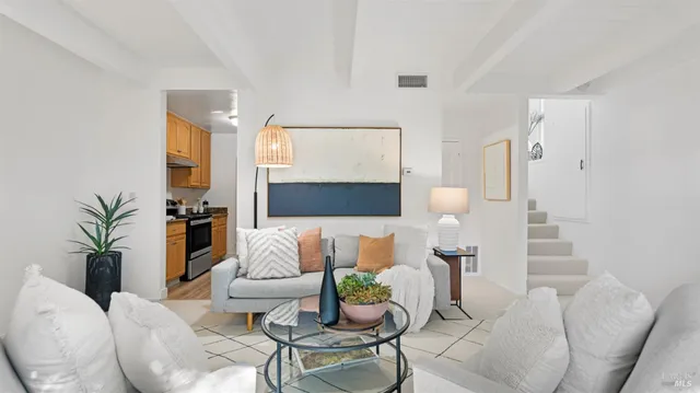 a living room with furniture and a lamp