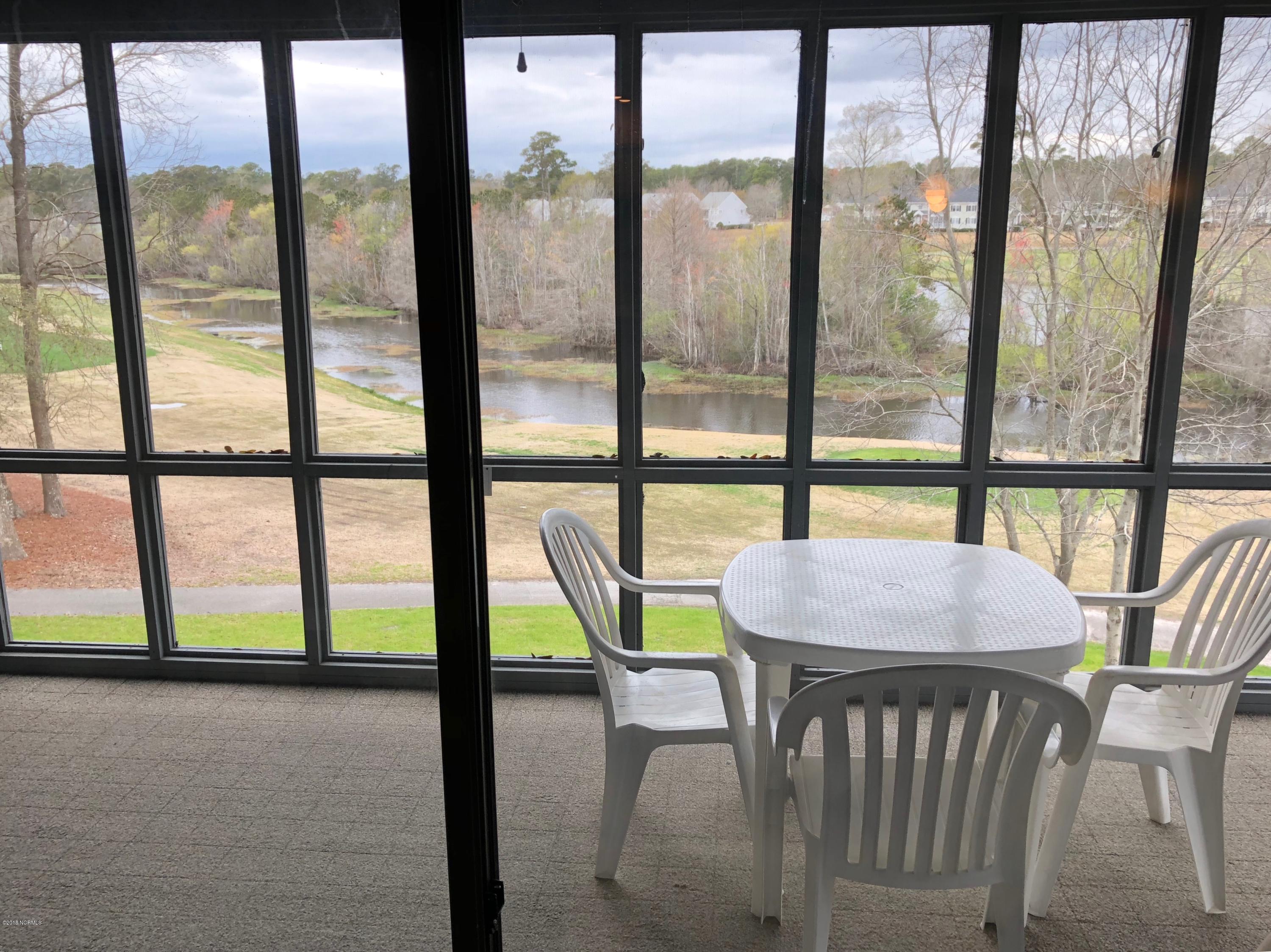 215 Clubhouse Road, Unit 206 Sunset Beach, NC 28468 - Photo 20 of 29 Huge Screened in Porch With Incredible Views!!!