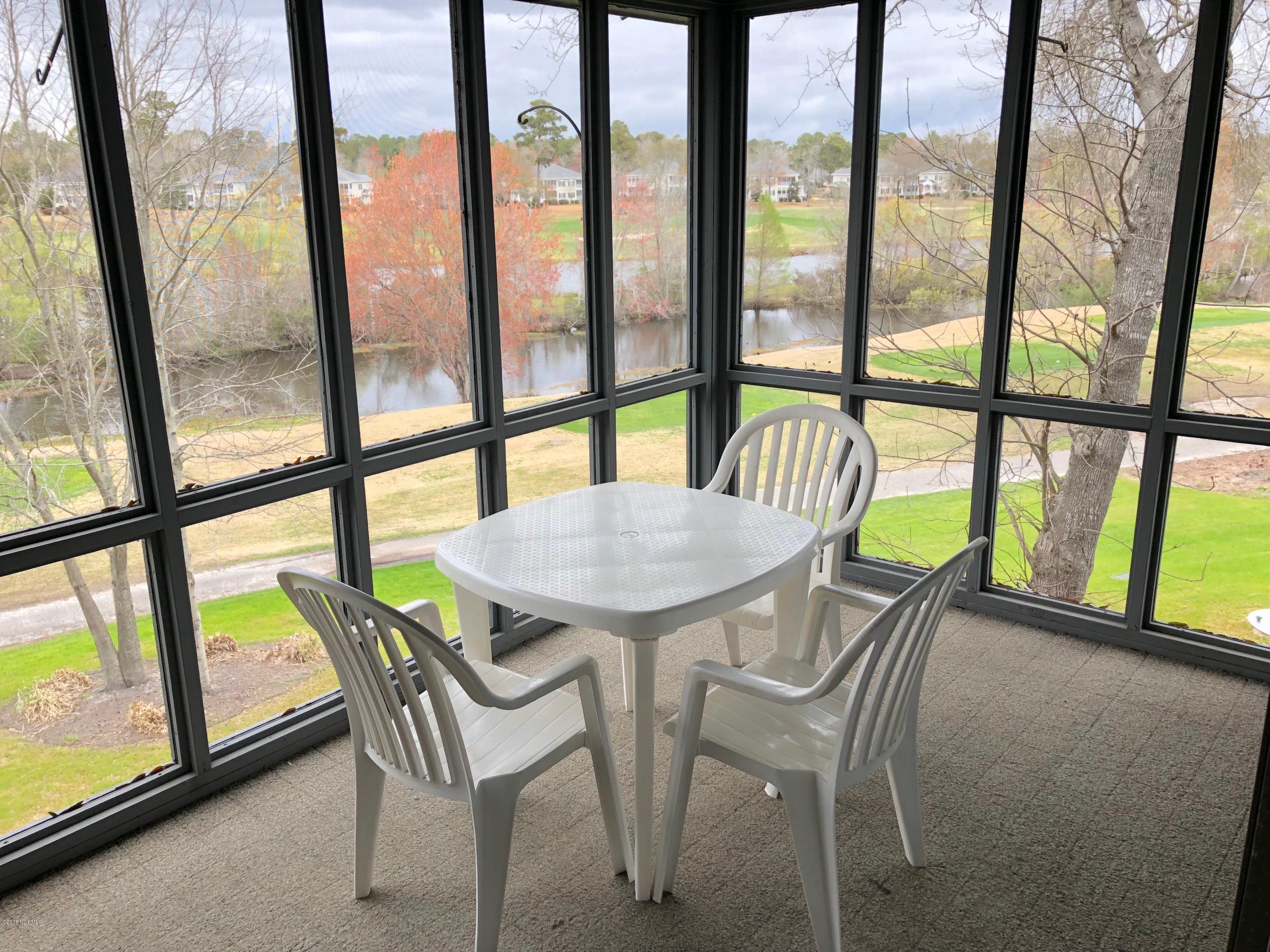 215 Clubhouse Road, Unit 206 Sunset Beach, NC 28468 - Photo 21 of 29 Huge Screened in Porch With Incredible Views!!!