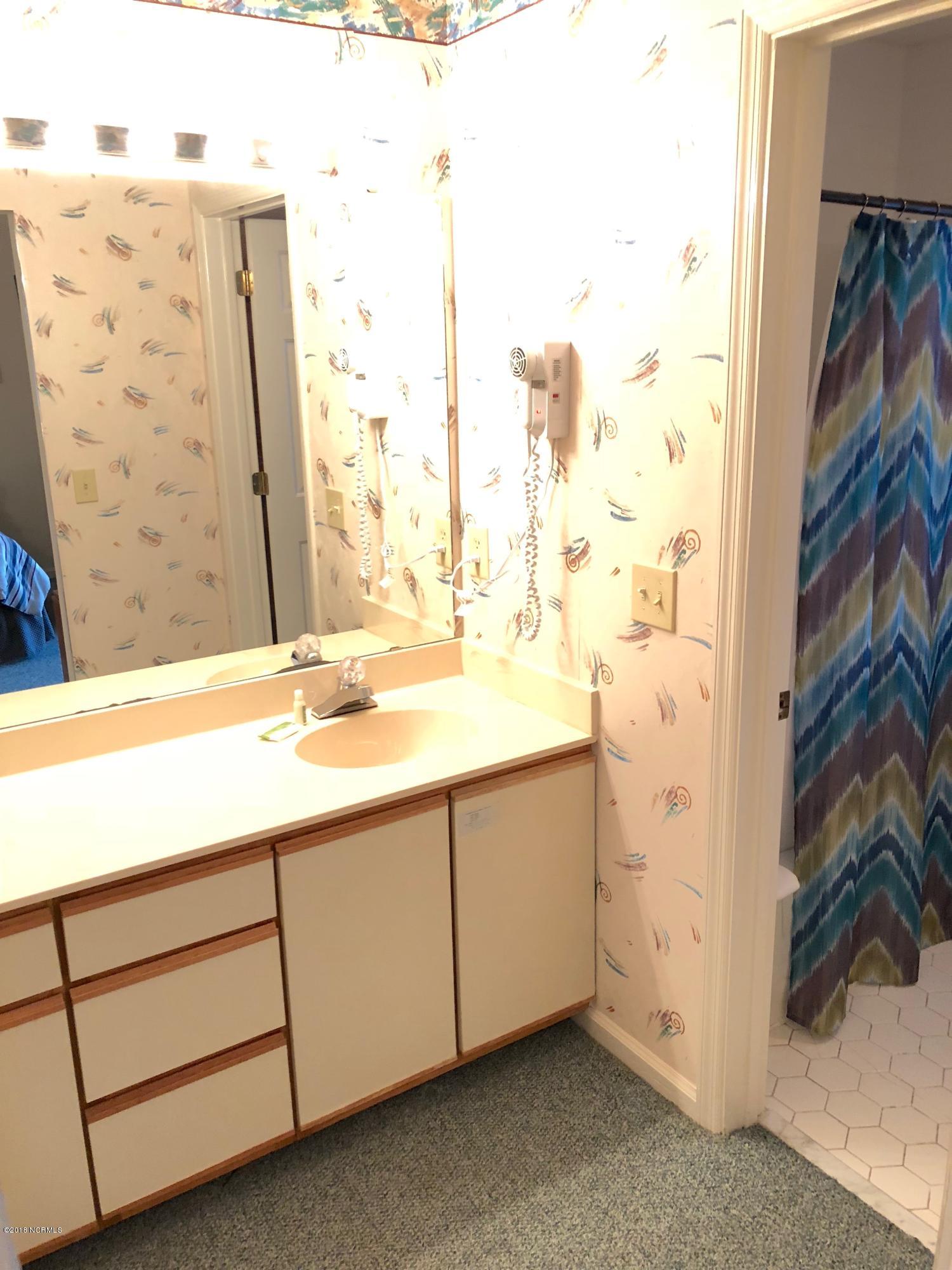 215 Clubhouse Road, Unit 206 Sunset Beach, NC 28468 - Photo 27 of 29 Mini Suite Bathroom