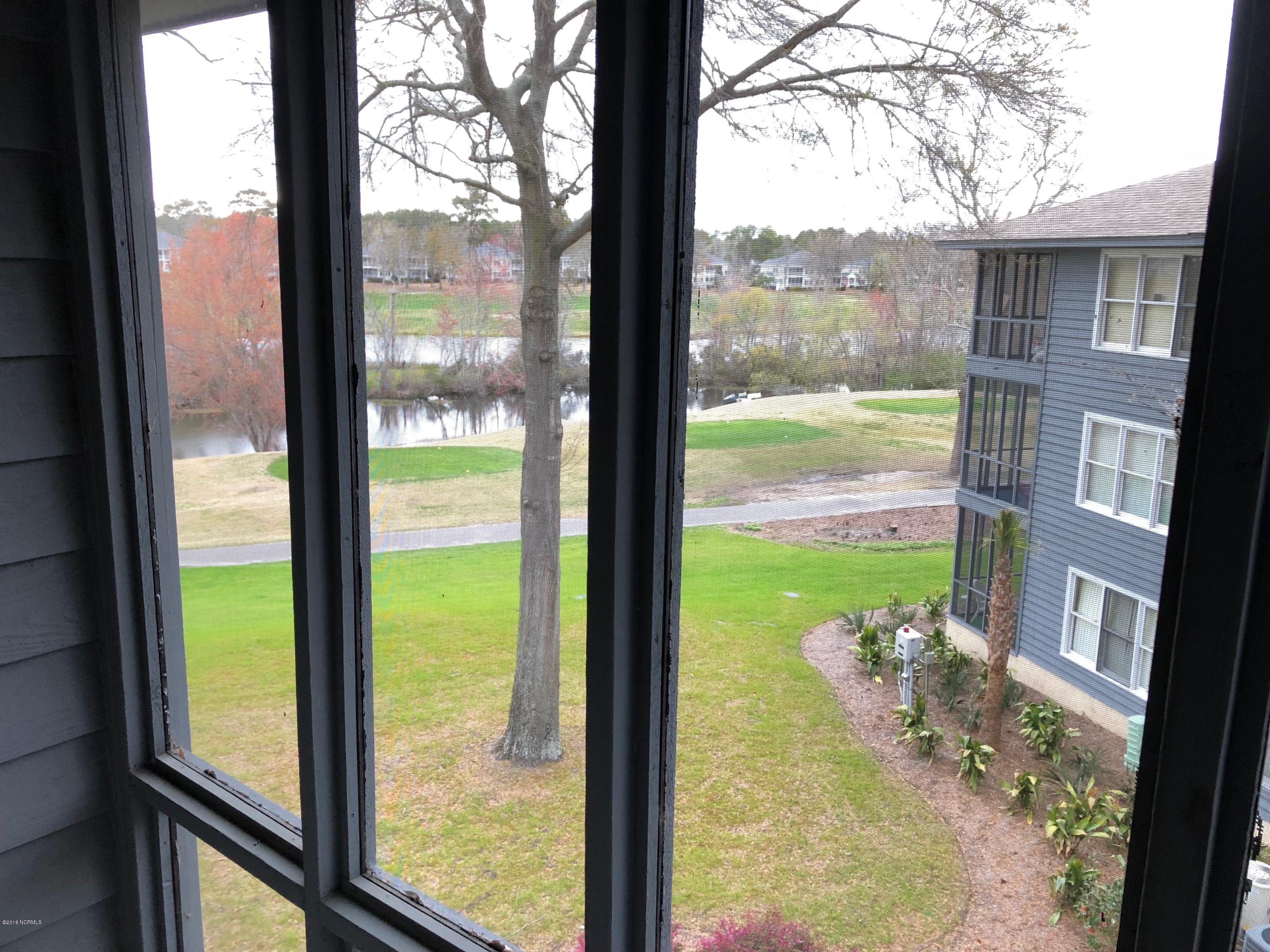 215 Clubhouse Road, Unit 206 Sunset Beach, NC 28468 - Photo 28 of 29 Mini Suite Screened in Porch