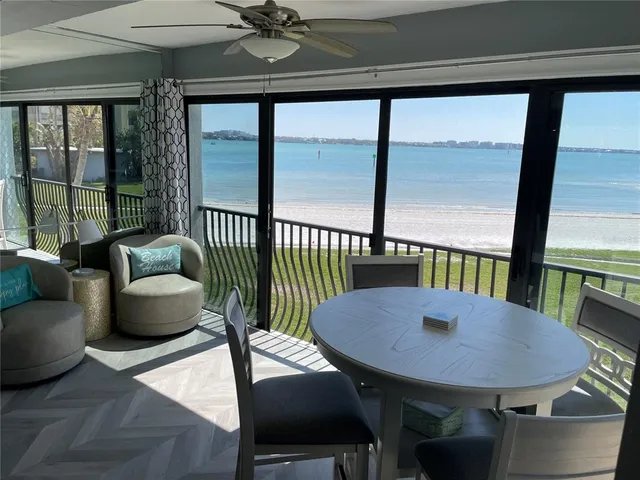 a large bed sitting in a bedroom next to a window