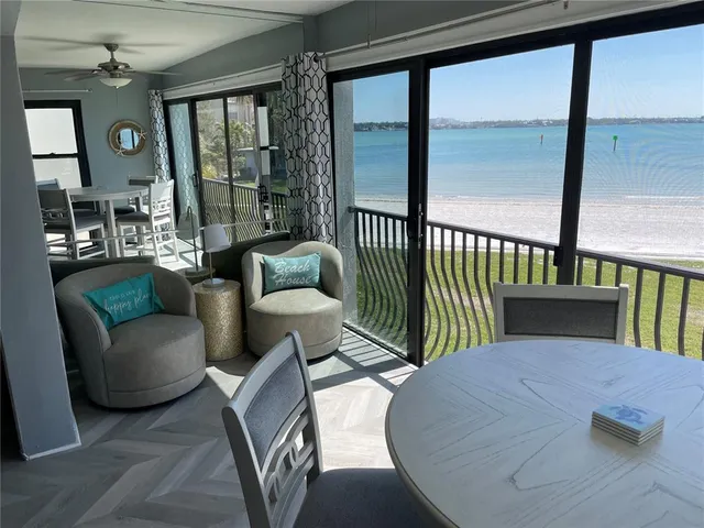 a bedroom with a bed and two chandelier