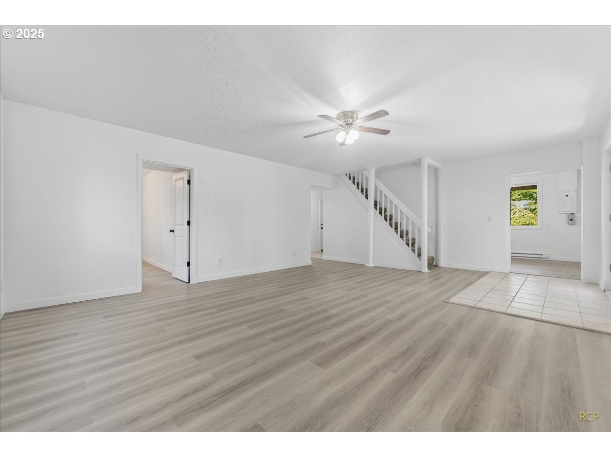 11420 Southeast Clinton Street Portland, OR 97266 - Photo 10 of 34 a view of an empty room with a window