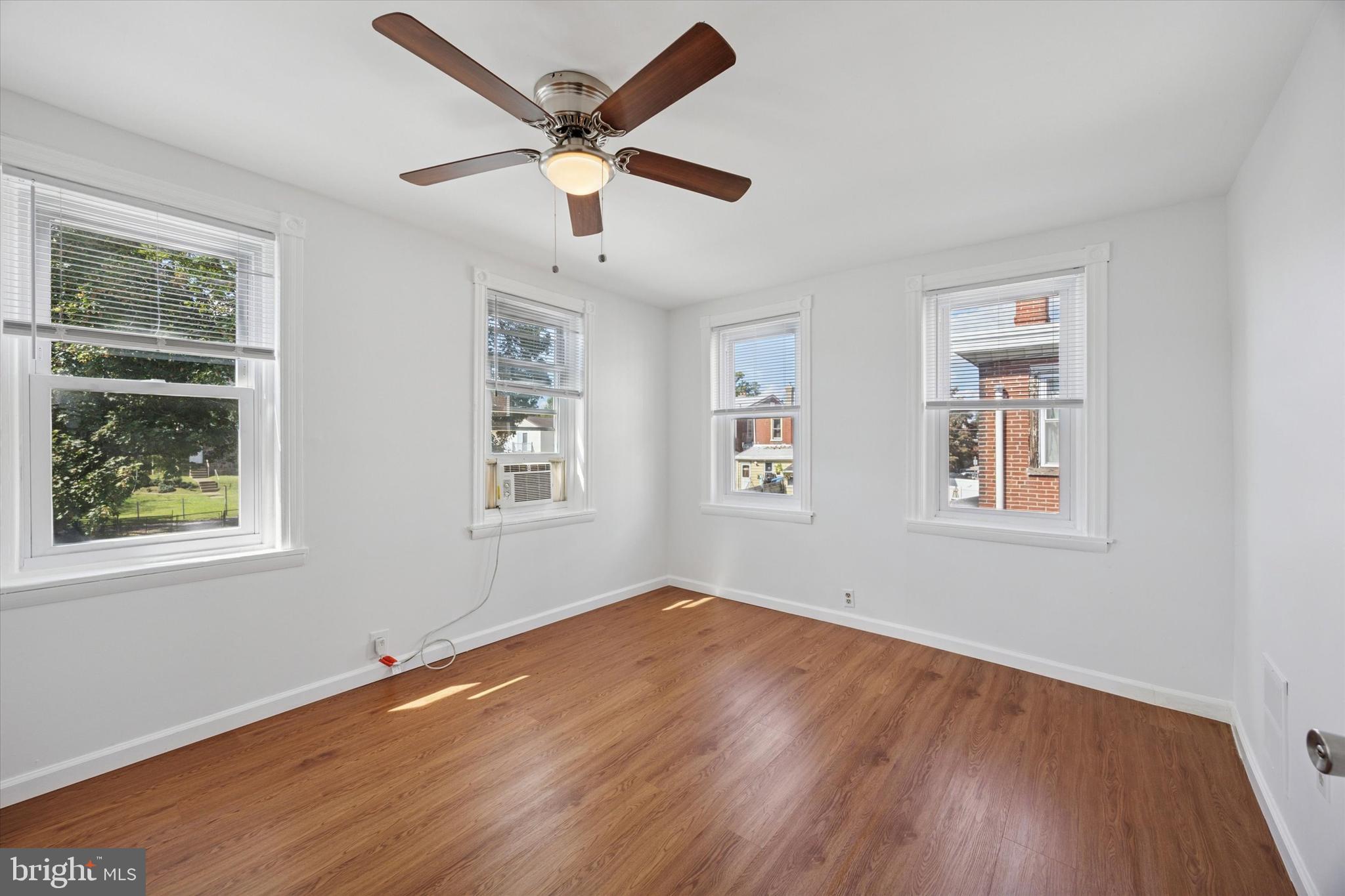 4312 Rhawn Street Philadelphia, PA 19136 - Photo 17 of 18 a view of empty room with wooden floor and fan