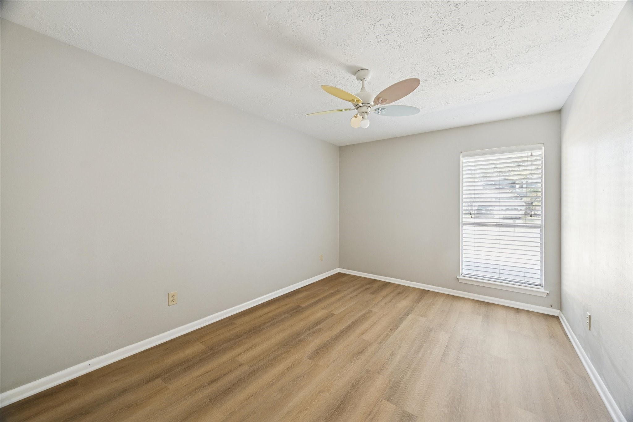 25903 Long Hill Lane Spring, TX 77373 - Photo 17 of 20 an empty room with wooden floor and windows