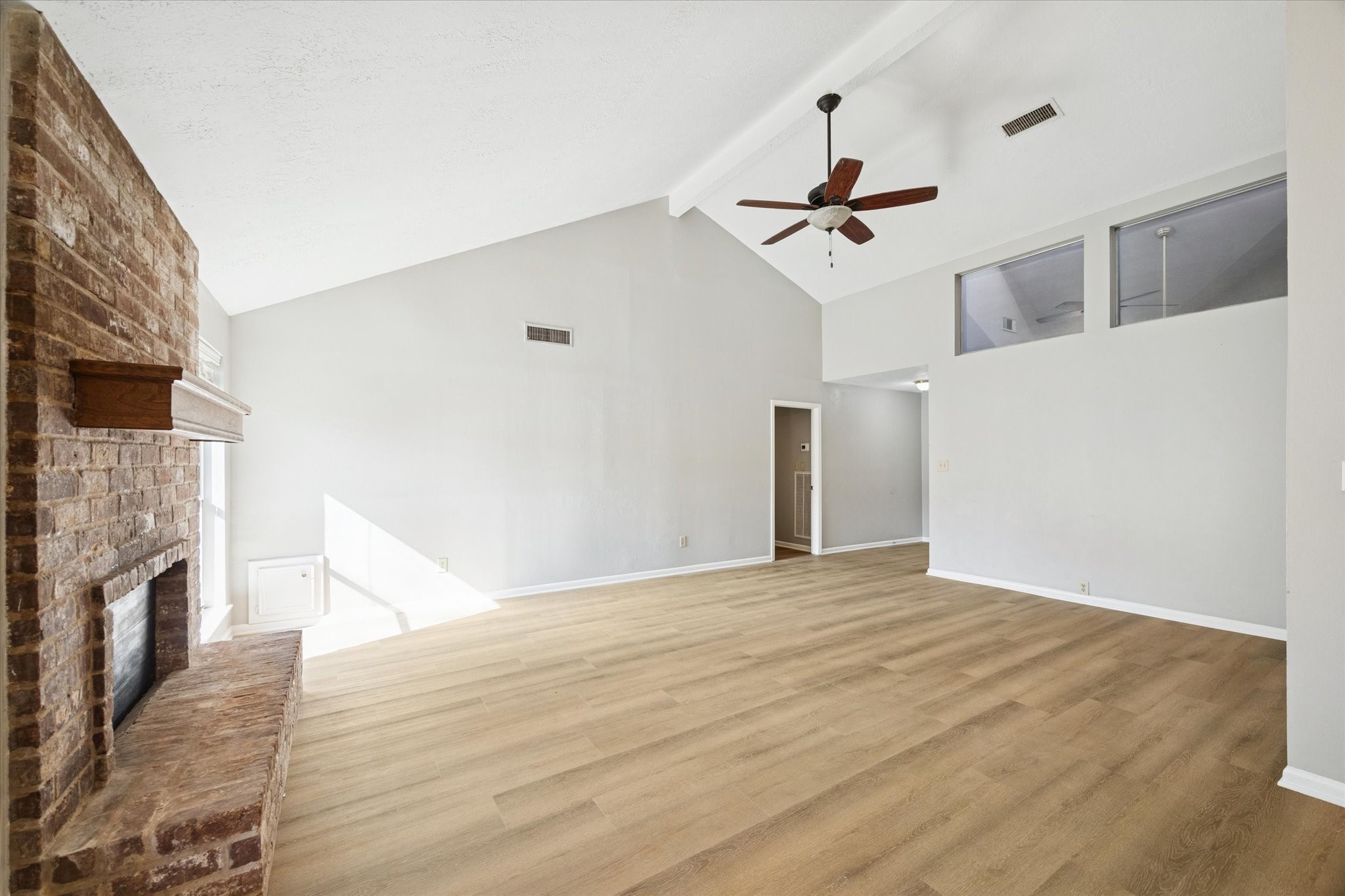25903 Long Hill Lane Spring, TX 77373 - Photo 4 of 20 a view of a livingroom with a ceiling fan wooden floor and a ceiling fan