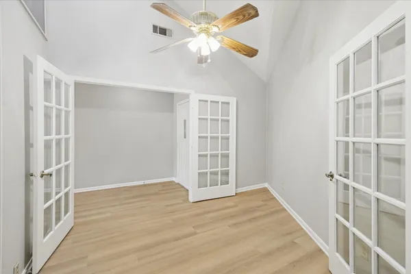 a view of an empty room with a window