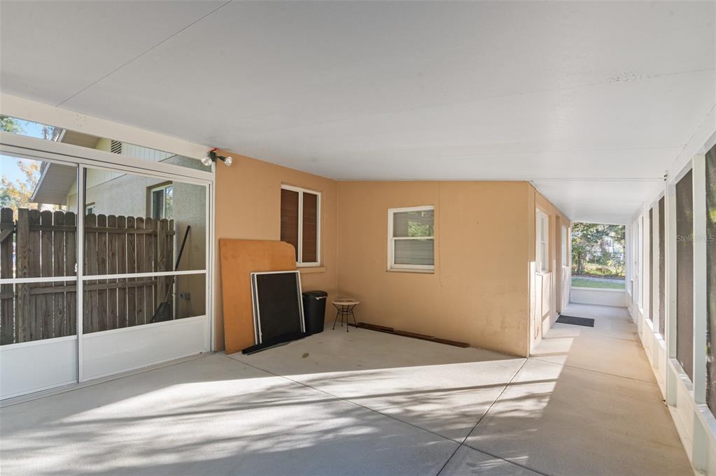 10620 Fawn Drive New Port Richey, FL 34654 - Photo 34 of 49 a view of a livingroom with wooden floor and white walls