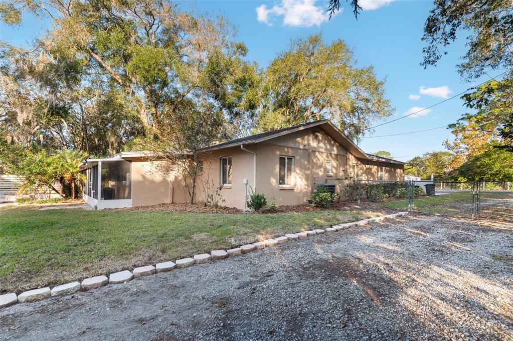 10620 Fawn Drive New Port Richey, FL 34654 - Photo 39 of 49 a view of a house with a yard